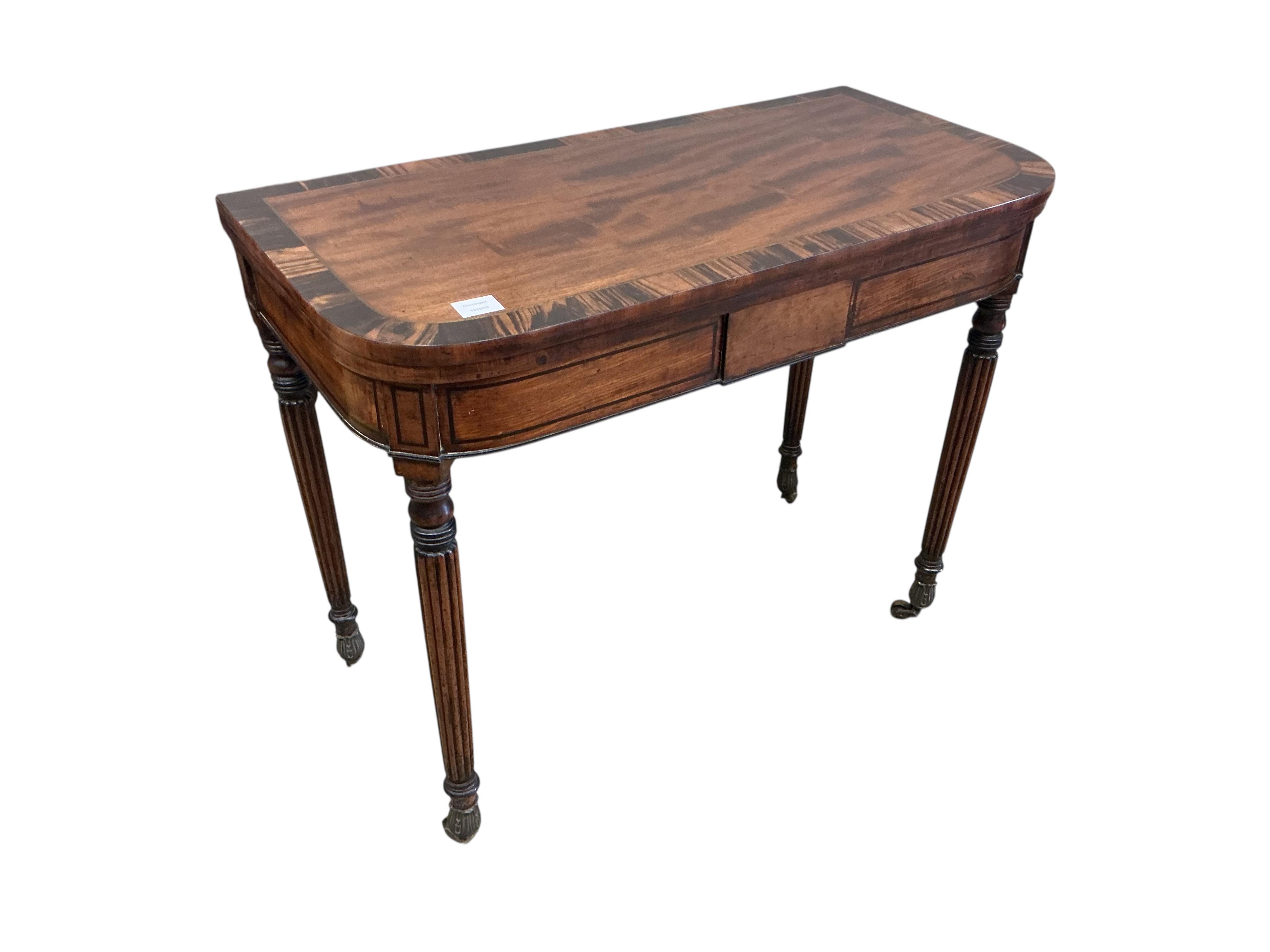 A Regency brass inlaid coromandel banded mahogany folding card table, width 91cm, depth 46cm, height 74cm